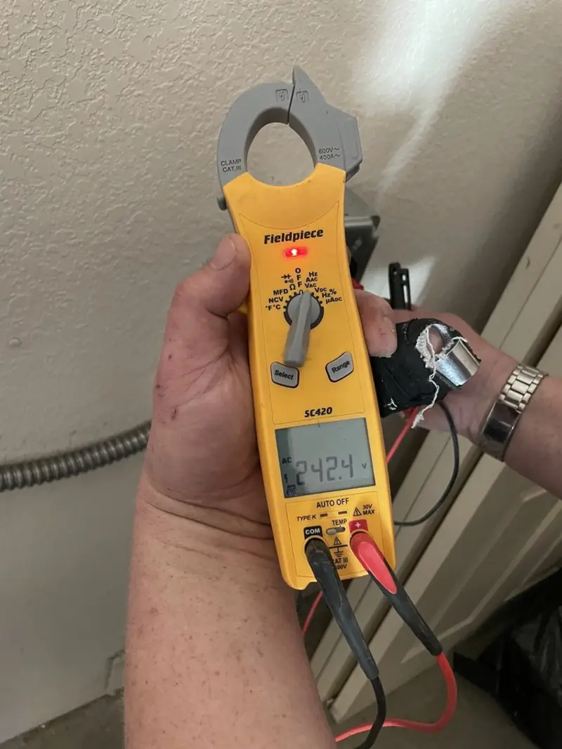 Voltage testing with clamp meter during Electrical Installation Services in New Cumberland